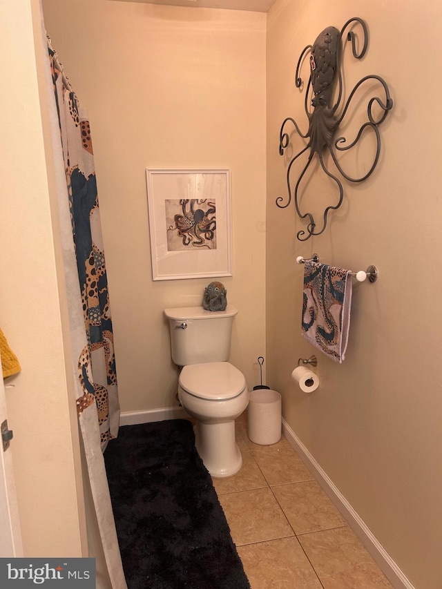 bathroom with tile patterned floors and toilet