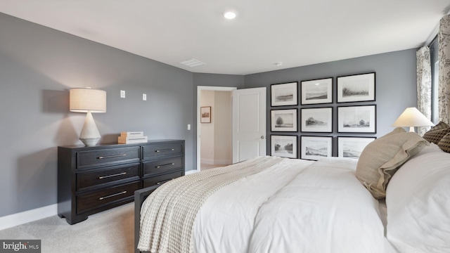 bedroom with light colored carpet