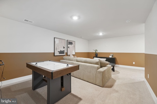 recreation room featuring light colored carpet