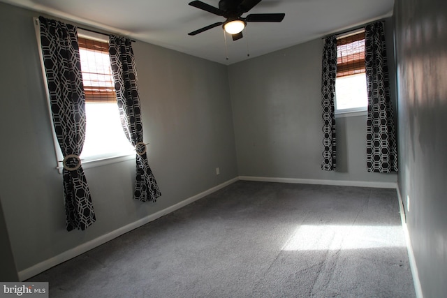 unfurnished room with carpet flooring, ceiling fan, and plenty of natural light