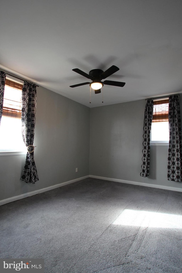 unfurnished room with carpet flooring and ceiling fan