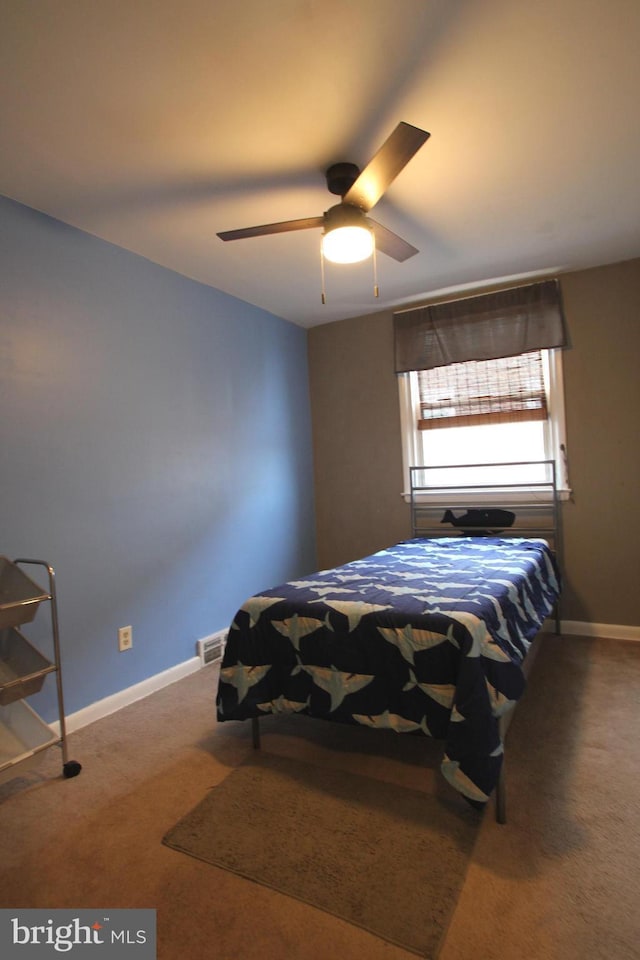 carpeted bedroom featuring ceiling fan