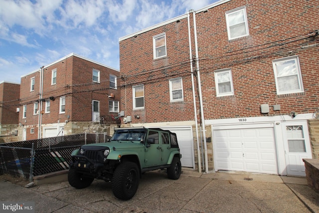 back of house with a garage