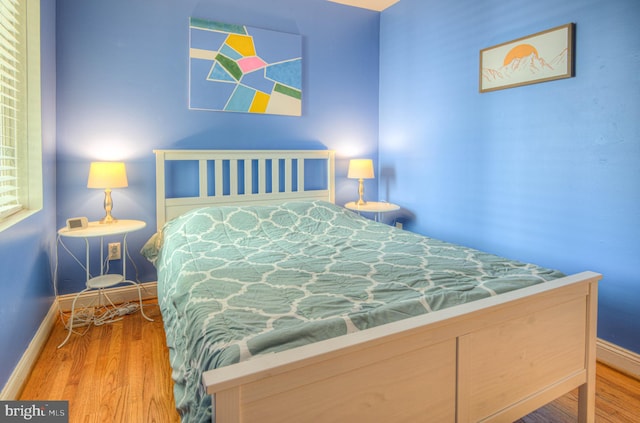 bedroom featuring wood-type flooring