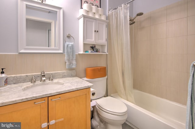 full bathroom with shower / bathtub combination with curtain, vanity, and toilet