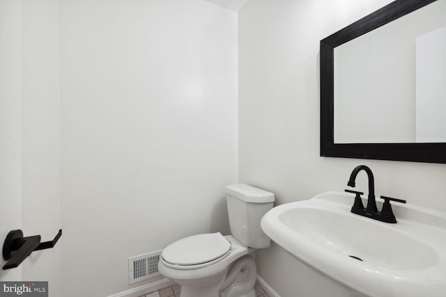 bathroom with toilet and sink