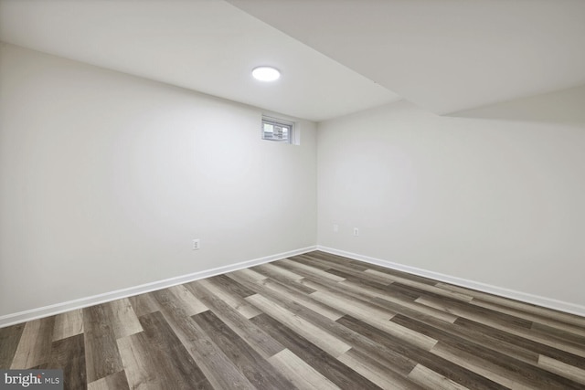 basement with dark wood-type flooring