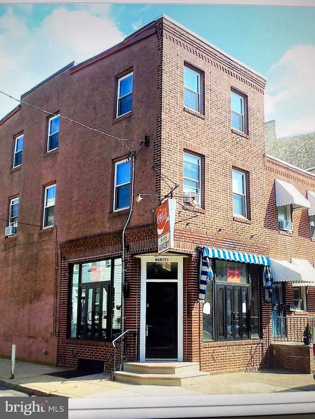 view of building exterior with cooling unit