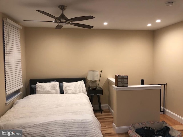 bedroom featuring ceiling fan and light hardwood / wood-style flooring