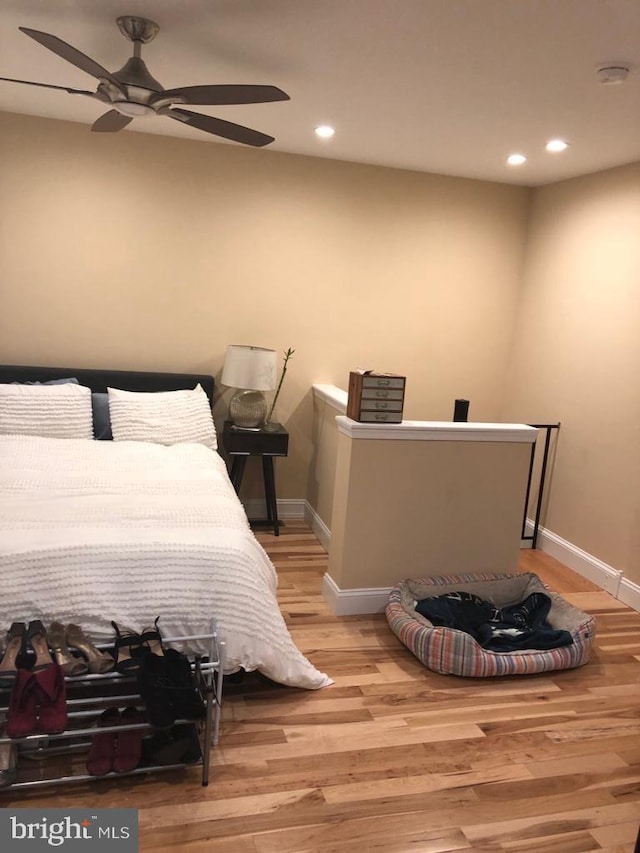 bedroom featuring ceiling fan and light hardwood / wood-style floors