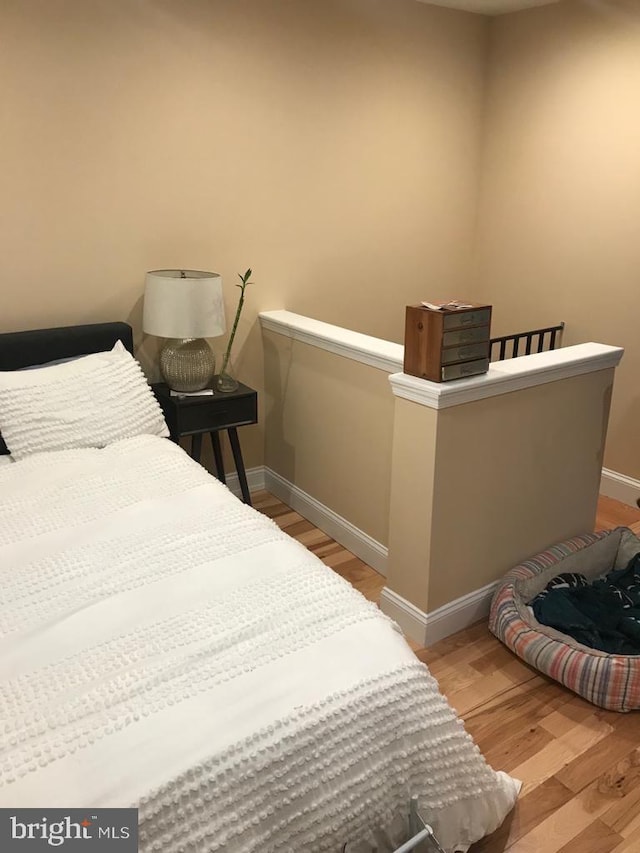 bedroom featuring wood-type flooring