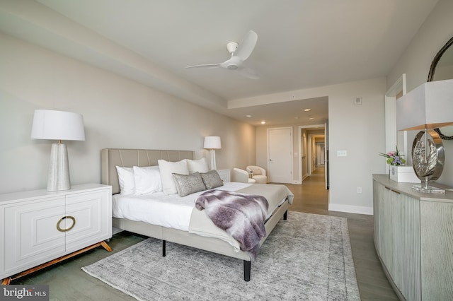 bedroom featuring dark wood-type flooring and ceiling fan