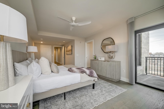 bedroom with ceiling fan, light hardwood / wood-style flooring, and access to outside