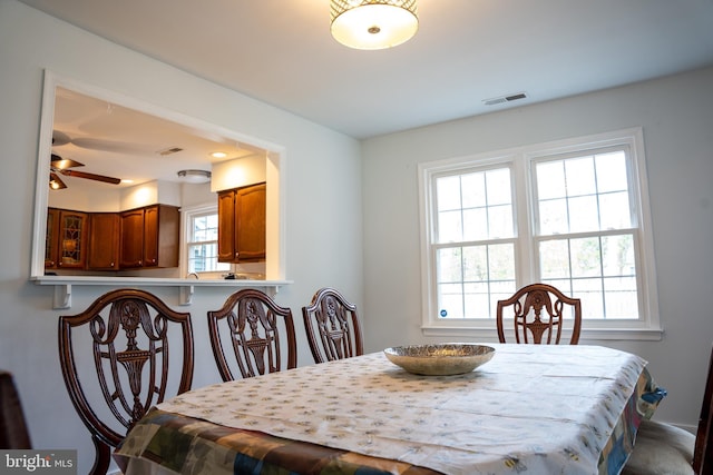 dining area with ceiling fan