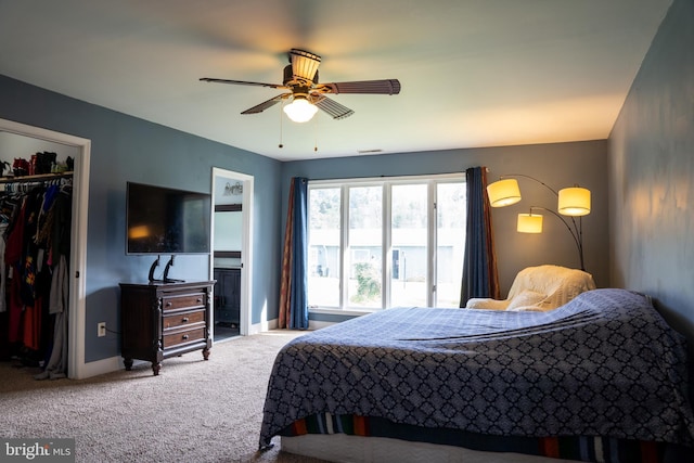 bedroom featuring ceiling fan, carpet, and a closet