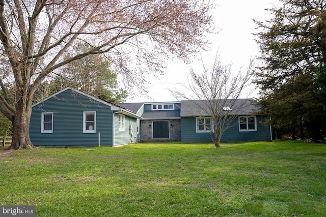 back of house with a yard