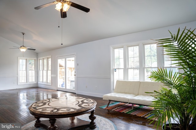 living room with ceiling fan, dark hardwood / wood-style floors, and lofted ceiling