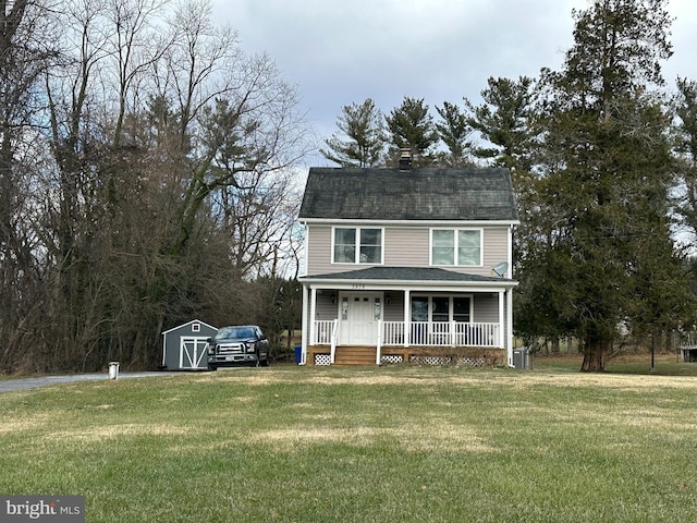 view of front of house featuring covered porch and a front yard