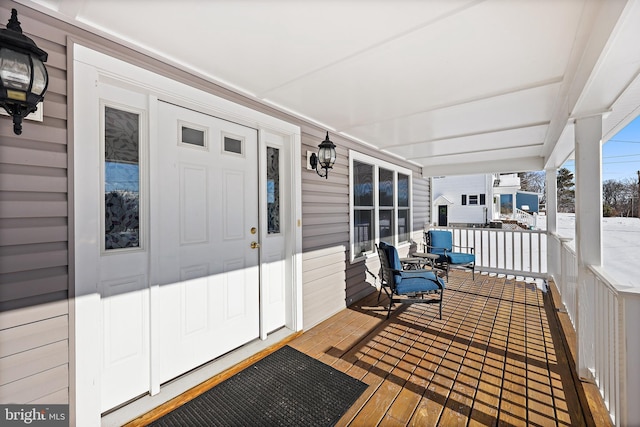 wooden deck featuring covered porch