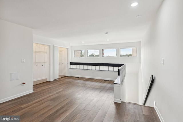 unfurnished room with dark hardwood / wood-style floors