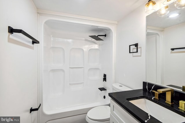 full bathroom featuring vanity, shower / bathing tub combination, and toilet