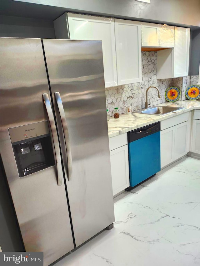 kitchen featuring white cabinets, stainless steel fridge with ice dispenser, black dishwasher, and sink