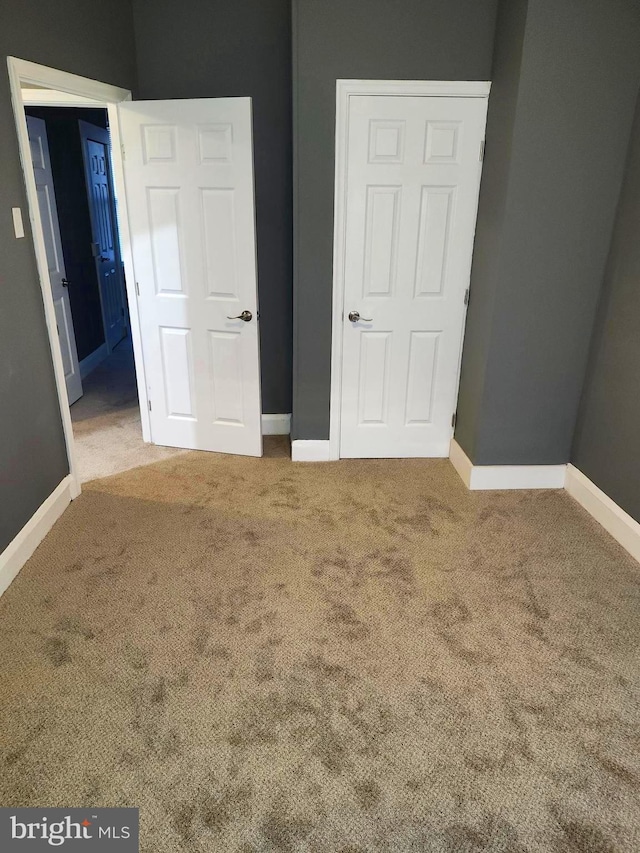 unfurnished bedroom featuring carpet floors