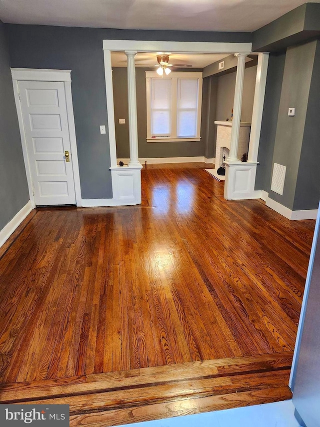 unfurnished living room featuring wood-type flooring