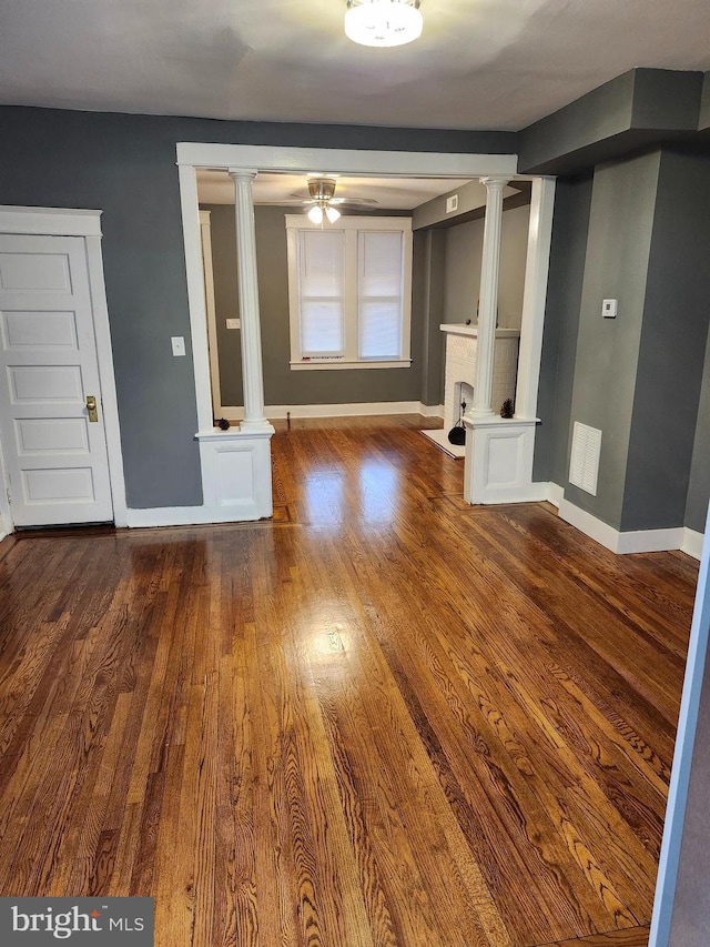 unfurnished living room with ceiling fan and wood-type flooring