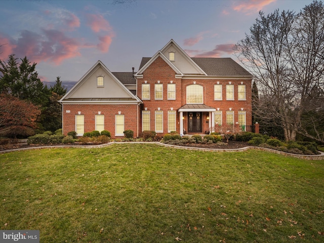 view of front of home with a yard