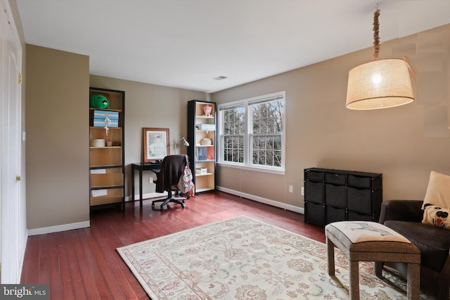 office space with dark wood-type flooring