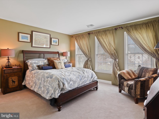 bedroom featuring light carpet