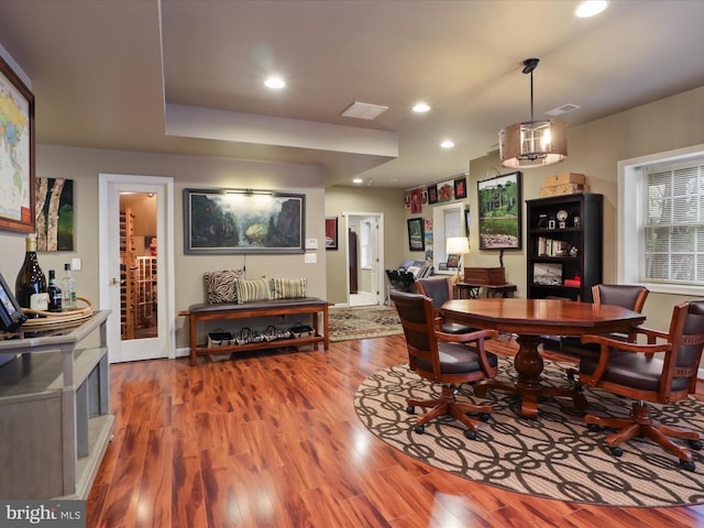 dining space with hardwood / wood-style flooring