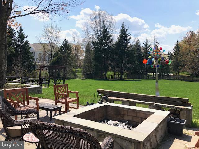 view of patio with a fire pit