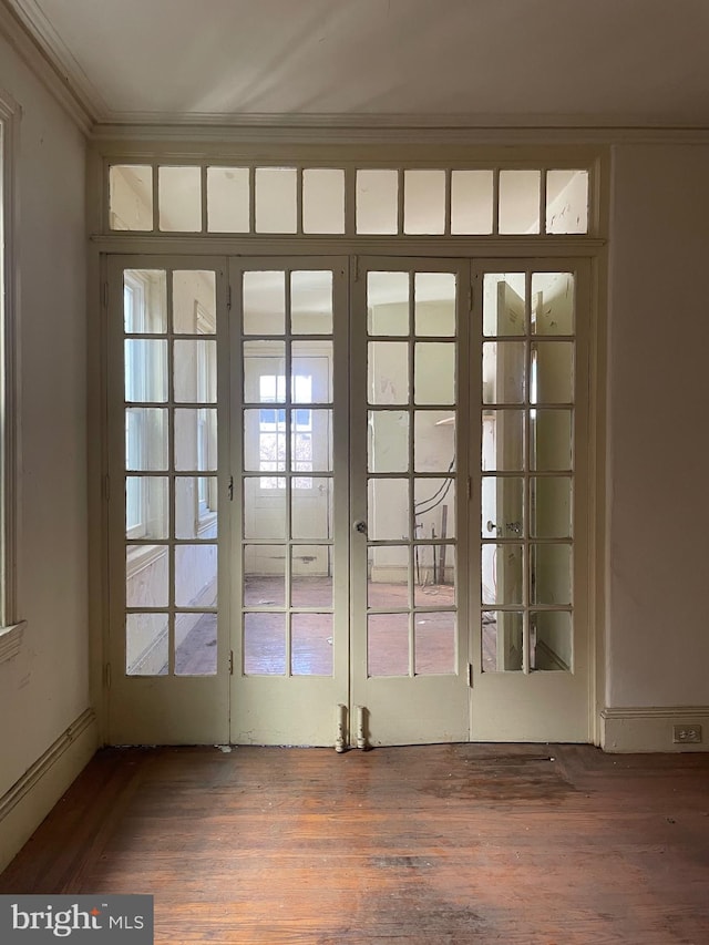 doorway to outside with french doors, hardwood / wood-style flooring, and crown molding