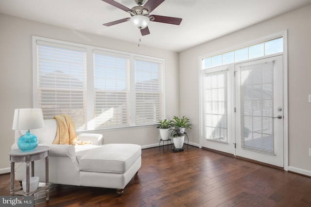 sitting room with dark hardwood / wood-style flooring, a wealth of natural light, and ceiling fan