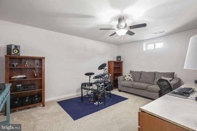 carpeted living room with ceiling fan