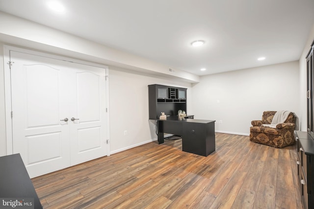 office space with dark wood-type flooring