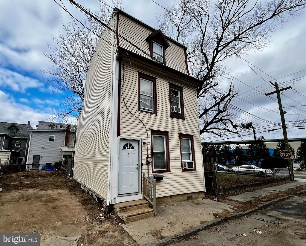 view of front of property featuring cooling unit