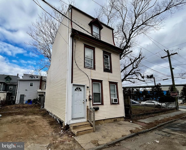 view of front of property featuring cooling unit