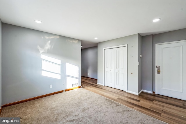 empty room with light hardwood / wood-style flooring