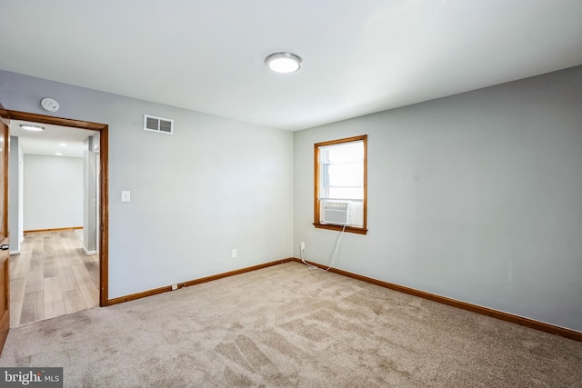 carpeted empty room featuring cooling unit