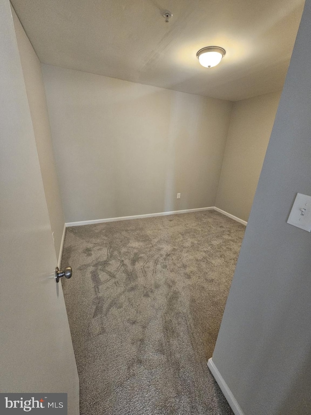 unfurnished room featuring carpet flooring