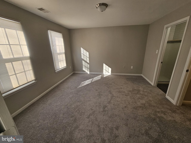 empty room featuring carpet floors