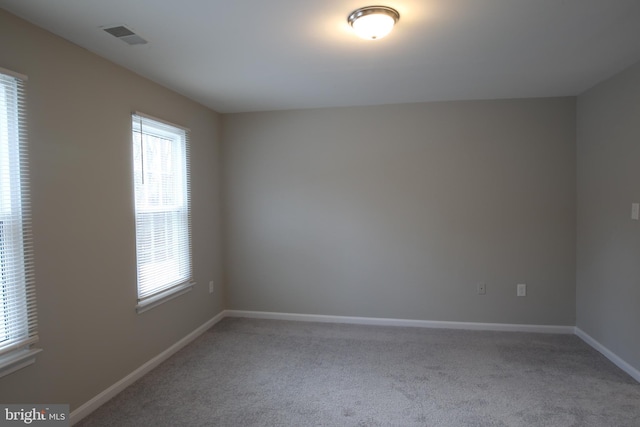 unfurnished room with carpet floors