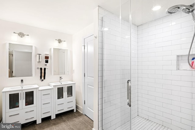 bathroom with a shower with door and vanity