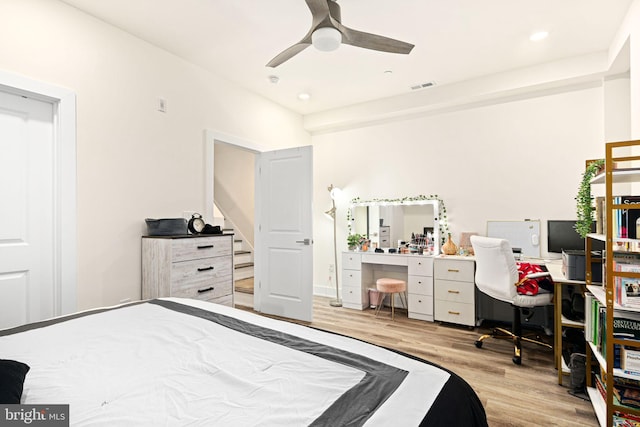 bedroom with ceiling fan and light wood-type flooring