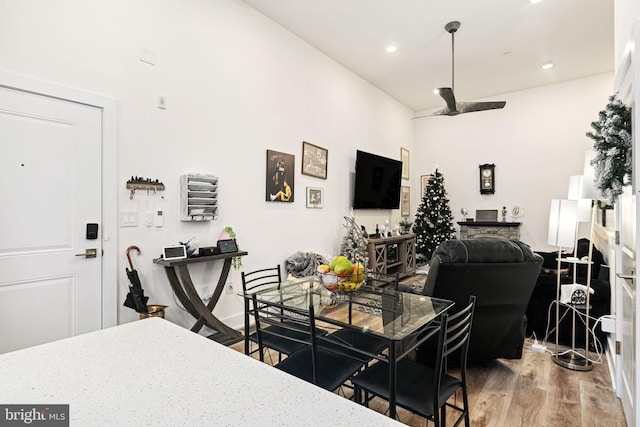 dining space featuring hardwood / wood-style flooring and ceiling fan