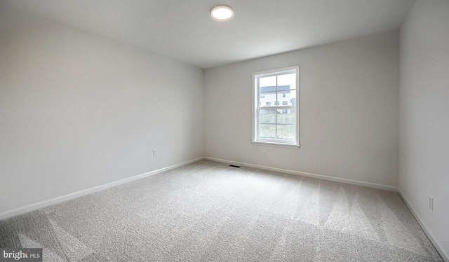 spare room featuring carpet