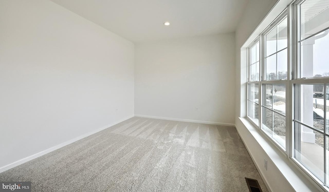 empty room featuring carpet flooring